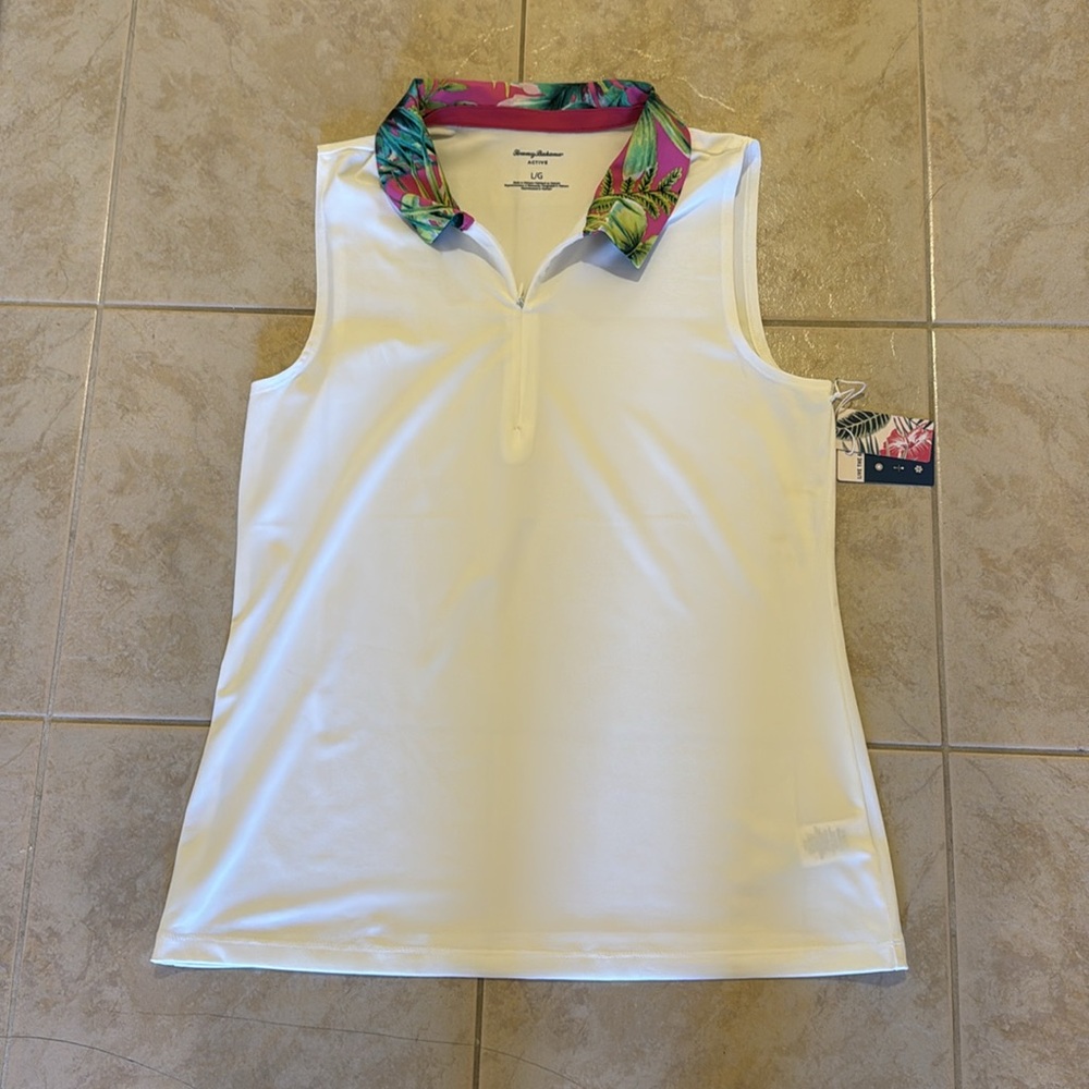 Tommy Bahama. Women’s golf tee. Size large. NEW WITH TAGS!!!